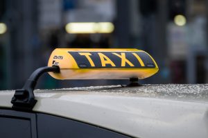 The roof of a taxi with the light saying tax highlighted